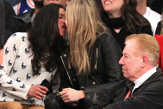 1/7/2014 - Detroit Pistons vs. New York Knicks at Madison Square Garden - Actress Michelle Rodriguez kissing model Cara Delevingne while sitting in the front row during the 4th quarter. The two were hugging and touching each other and Rodriguez appeared to be very intoxicated.