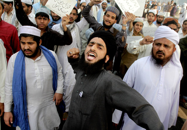 Pakistani supporters of Mumtaz Qadri protest his execution in Lahore, Pakistan, Monday, February 29, 2016. Pakistan on Monday hanged Qadri, the convicted killer of a former governor, shot in 2011 by his bodyguard who accused him of blasphemy, officials said. (Photo by K.M. Chaudary/AP Photo)