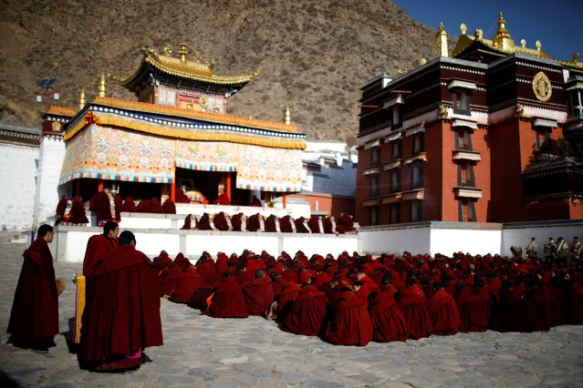 Tibetan monks attend a ceremony at the Labrang Monastery ahead of “Sunbathing Buddha Festival”, in Xiahe county, Gansu Province, China on February 16, 2019. (Photo by Aly Song/Reuters)