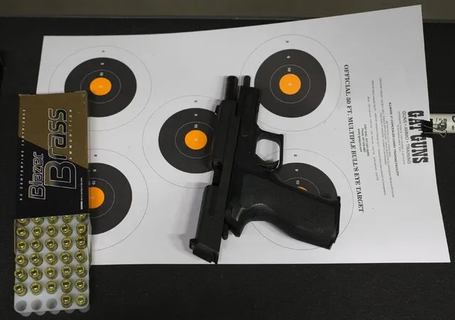 A handgun lies on a target at the shooting range during a meeting of The Well Armed Woman Shooting Chapters at GAT Guns in East Dundee, Illinois, April 21, 2015. (Photo by Jim Young/Reuters)