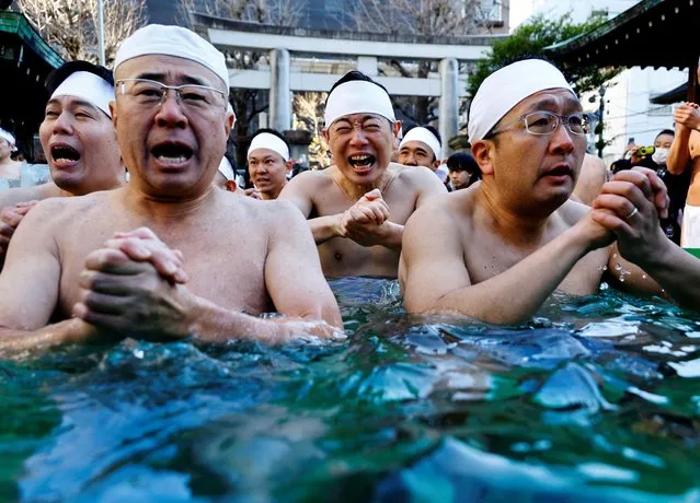 Participants pray as they take an ice-cold bath during a ceremony to purify their souls and to pray for the new year at the Teppozu Inari shrine in Tokyo, Japan, on January 14, 2024. (Photo by Kim Kyung-Hoon/Reuters)