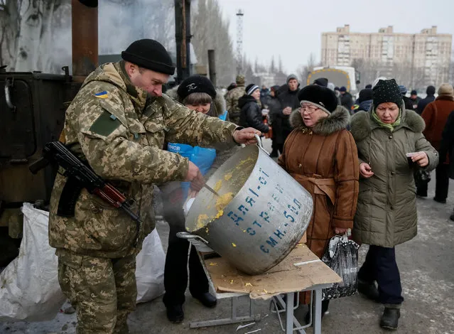 Local residents have a meal at an emergency center after shelling hit supply infrastructure in the government-held industrial town of Avdiyivka, Ukraine, February 3, 2017. (Photo by Gleb Garanich/Reuters)