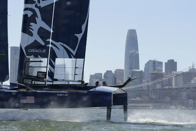 The U.S. team F50 foiling catamaran trains after its launch Monday, April 22, 2019, in San Francisco. New global sports league SailGP launched the first of six F50 race boats into San Francisco Bay that will compete May 4-5. The 50-foot long catamaran is capable of hitting speeds of 60 miles per hour. In the background is the Salesforce Tower. (Photo by Eric Risberg/AP Photo)