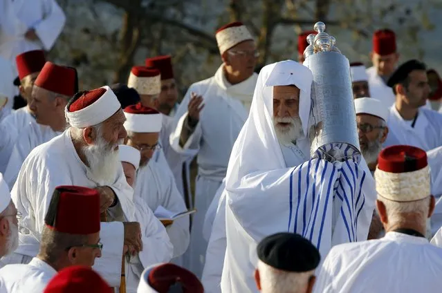 Members of the Samaritan sect take part in a traditional pilgrimage marking the holiday of Passover on Mount Gerizim, near the West Bank city of Nablus May 9, 2015. The Samaritans, who trace their roots to the Biblical kingdom of Israel in what is now the northern occupied West Bank, observe religious practices similar to those of Judaism. (Photo by Abed Omar Qusini/Reuters)