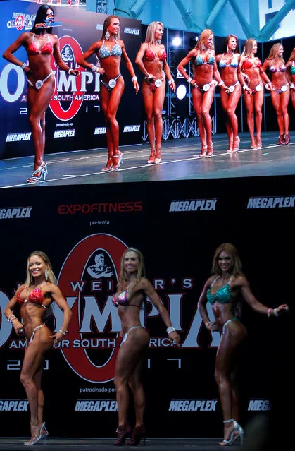 Women participate during the Mr. Olympia Amateur South America bodybuilding competition in Medellin, Colombia, February 19, 2017. (Photo by Fredy Builes/Reuters)