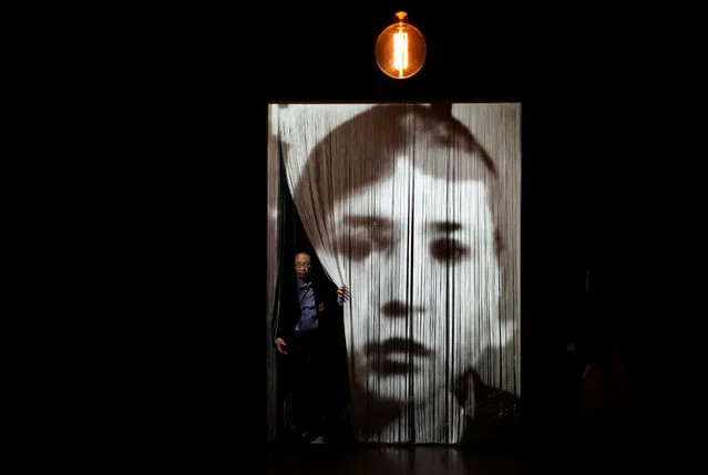 A visitor walks through the artwork “Entre-temps” by French artist Christian Boltanski during the press preview of the “Christian Boltanski – Lifetime” exhibition at the National Art Center in Tokyo, Japan, 11 June 2019. The exhibition presents almost 50 artworks by the artist and will be open to the public from 12 June to 02 September 2019. (Photo by Franck Robichon/EPA/EFE)