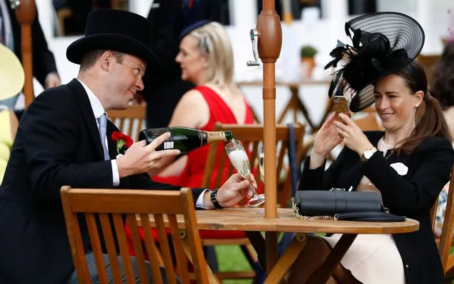 Racegoers enjoy refreshments at The Orangerie Bar by Moët & Chandon Grand Vintage within the Royal Enclosure on day 2 of Royal Ascot at Ascot Racecourse on June 19, 2019 in Ascot, England. (Photo by John Phillips/Getty Images for Ascot Racecourse)