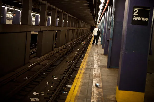 A man waits for the New York subway prior to the arrival of Hurricane Sandy on October 28, 2012 in New York, United States. New York plans on shutting down the entire public transmit system starting at 7PM, Sunday night. Sandy, which has already claimed over 50 lives in the Caribbean, is predicted to bring heavy winds and floodwaters as the mid-atlantic region prepares for the damage. (Photo by Andrew Burton/Getty Images)