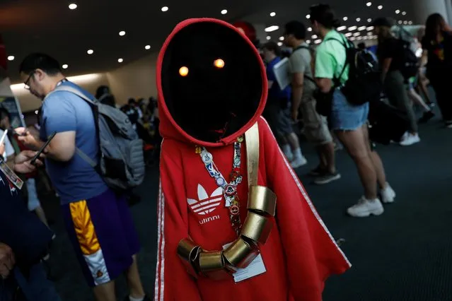 An attendee poses for a picture as they arrive in a costume to enjoy Comic Con International in San Diego, California, U.S., July 19, 2019. (Photo by Mike Blake/Reuters)