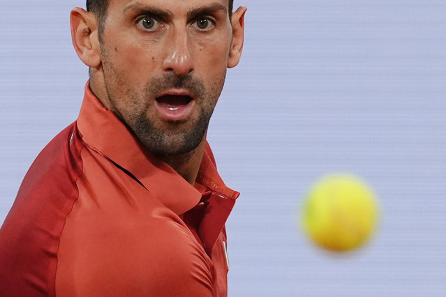 Serbia's Novak Djokovic eyes the ball as he plays against Spain's Roberto Carballes Baena during their men's singles match on Court Philippe-Chatrier on day five of the French Open tennis tournament at the Roland Garros Complex in Paris on May 30, 2024. (Photo by Dimitar Dilkoff/AFP Photo)