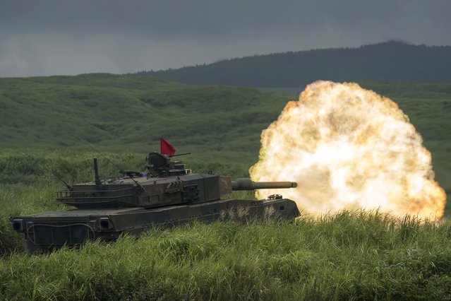 A Japan Ground Self-Defense Force Type 10 battle tank fires ammunition during a live fire exercise at the foot of Mount Fuji in the Hataoka district of the East Fuji Maneuver Area on August 22, 2019 in Gotemba, Shizuoka, Japan. The three-day annual live-fire drill takes place as the nation's Defense Ministry is expected to submit a record request of the fiscal 2020 budget this month. (Photo by Tomohiro Ohsumi/Getty Images)