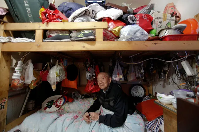 A man surnamed Zeng looks into the camera as he sits on his bed, in Guangfuli neighbourhood in Shanghai, China, April 18, 2016. Zeng, 89, lives alone and keeps all his belongings within reach on his bed as he has difficulty walking. (Photo by Aly Song/Reuters)