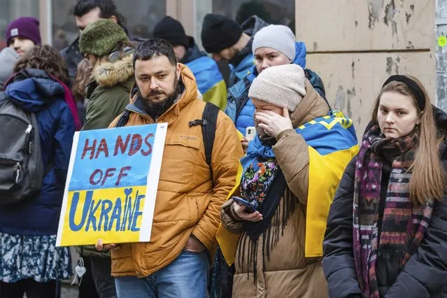 People including Ukrainians, take part in a demonstration in support of Ukraine, outside the Russian Embassy in Tallinn, Estonia, Thursday, February 24, 2022. Russia launched a wide-ranging attack on Ukraine on Thursday, hitting cities and bases with airstrikes or shelling, as civilians piled into trains and cars to flee. Ukraine's government said Russian tanks and troops rolled across the border in a “full-scale war” that could rewrite the geopolitical order and whose fallout already reverberated around the world. (Photo by Raul Mee/AP Photo)