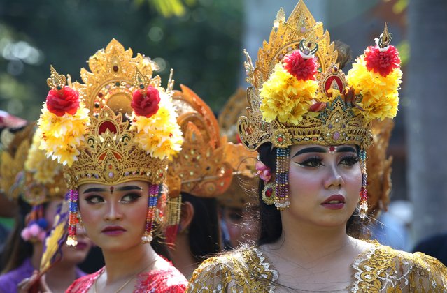 Women dancers perform during a parade at the opening of the Bali arts festival in Denpasar, Bali, Indonesia on Saturday, June 15, 2024. (Photo by Firdia Lisnawati/AP Photo)