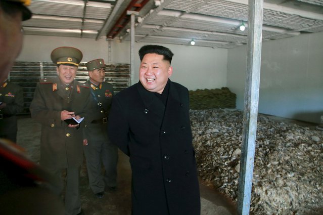 North Korean leader Kim Jong Un gives field guidance at a fish meal fodder factory, newly built by the Korean People's Army (KPA) in this undated photo released by North Korea's Korean Central News Agency (KCNA) in Pyongyang March 24, 2015. (Photo by Reuters/KCNA)