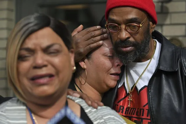 Antoinette Walker cries on the shoulder of Frank Turner as Penelope Scott speaks to the media during an interview at the corner of 10th and K street in Sacramento, Calif., on Monday, April 4, 2022. Walker is the older sister of De'vazia Turner, who was shot and killed during a mass shooting a day earlier. Frank Turner and Penelope Scott are the mother and father of De'vazia Turner. Multiple people were killed and injured in the shooting  (Photo by Jose Carlos Fajardo/Bay Area News Group via AP Photo)