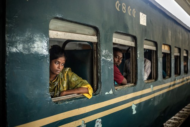 Commuters sit in a coach of an intercity train at the Kamalapur station as passenger railway services resumed in Dhaka on August 13, 2024, days after a student-led uprising that ousted the 15-year rule of ex-premier Sheikh Hasina. Bangladesh was experiencing a “student-led revolution” after the ouster of premier Sheikh Hasina, the South Asian country's new interim leader Muhammad Yunus said. “This is a revolution, a student-led revolution”, the Nobel laureate told a news briefing on August 11. (Photo by Luis Tato/AFP Photo)