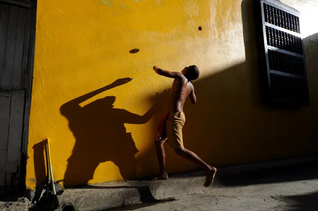 “The Flying Ball”. Children of the streets. Photo location: Barakoa, Cuba. (Photo and caption by Dana Caspi/National Geographic Photo Contest)
