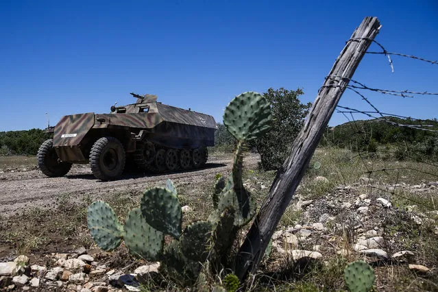 In this May 24, 2017, photo, DriveTanks.com customers drive on a tank course at Ox Ranch  in Uvalde, Texas. (Photo by Michael Ciaglo/Houston Chronicle via AP Photo)