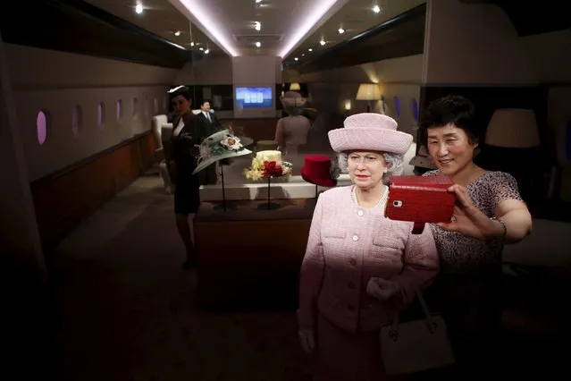 A woman takes a selfie with the wax figure of Britain's Queen Elizabeth II at Grevin Wax Museum in central Seoul, South Korea, July 30, 2015. (Photo by Kim Hong-Ji/Reuters)