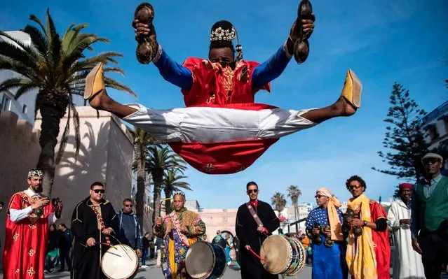 A Gnawa traditional group performs in the city of Essaouira on December 14, 2019, to celebrate the decision of adding the Gnawa culture to UNESCO's list of Intangible Cultural Heritage of Humanity. (Photo by Fadel Senna/AFP Photo)