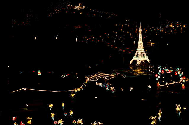 Colombia: A replical of Paris' Eiffel Tower is lit up for Christmas at Puente de Bocaya in Tunja, Colombia December 13, 2007. (Photo by Daniel Munoz/Reuters)