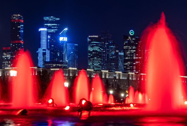 A view on skyscrapers of Moscow City International Business District through illuminated fountains in Victory Park in Moscow, Russia, on September 5, 2024. (Photo by Maxim Shemetov/Reuters)