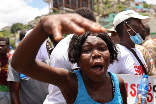 A member of the coalition “Du Sang neuf” (New Blood) yells during a march against gang violence and to call for new politicians with fresh ideas, in Port-au-Prince, Haiti on August 14, 2024. (Photo by Ralph Tedy Erol/Reuters)