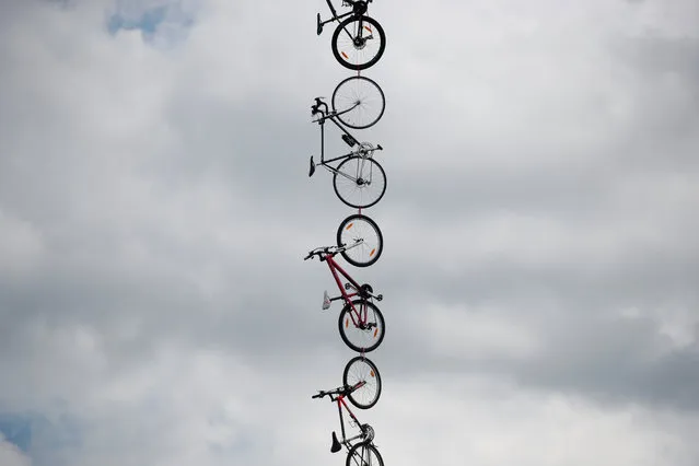 Bikes are seen hanging next to the road during the third stage of the Tour de France cycling race over 212.5 kilometers (132 miles) with start in Verviers, Belgium and finish in Longwy, France on July 3, 2017. (Photo by Benoit Tessier/Reuters)