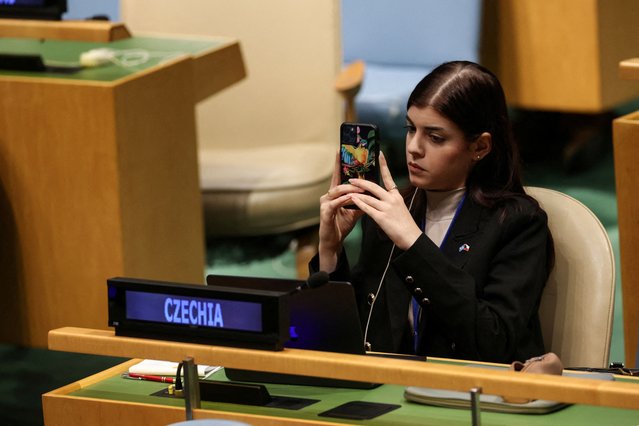 A representative of Czechia records as Mohammad Mustafa Prime Minister and Minister for Foreign Affairs of Palestine addresses the “Summit of the Future” in the General Assembly Hall of the United Nations Headquarters in New York City on September 23, 2024. (Photo by Caitlin Ochs/Reuters)