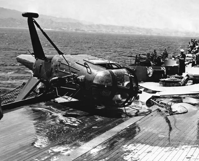 Gen. James Van Fleet, eighth army commander, and two others escaped injury when this helicopter crashed on the deck of the cruiser Los Angeles after being caught by a gust of wind in waters of Korea on July 6, 1951. (Photo by AP Photo)
