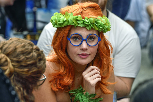 Milly Paris, dressed as Myrtle from Lilo and Stitch, waits in line to enter the D23 Expo in Anaheim, Calif., on Friday, July 14, 2017. (Photo by Jeff Gritchen/The Orange County Register via AP Photo)
