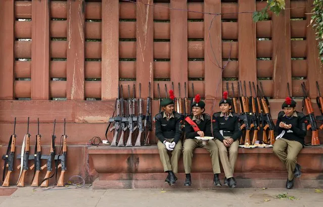 Members of the National Cadet Corps (NCC) eat during the rehearsal for the Republic Day parade in New Delhi, India, January 20, 2020. (Photo by Danish Siddiqui/Reuters)