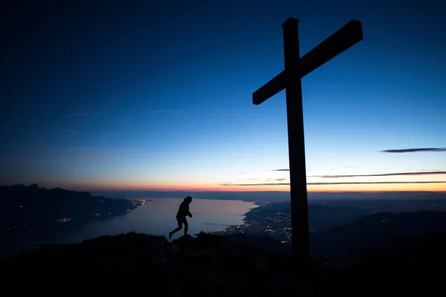 Anais walks on the Dent de Jaman mountain, 1875 meters above Montreux, with Lake Geneva in the background, Switzerland, 11 June 2017. (Photo by Anthony Anex/EPA)