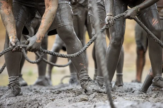 Competitors take part in “Tough Mudder” in Sonoma, California, United States on August 28, 2022. Tough Mudder is an endurance event series in which participants attempt 3-6-9 mile-long obstacle courses featuring steep inclines, water hazards and military-style obstacles testing one's toughness, fitness, strength, stamina and mental grit. (Photo by Tayfun Coskun/Anadolu Agency via Getty Images)