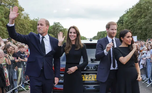 Catherine, Princess of Wales, Prince William, Prince of Wales, Prince Harry, Duke of Sussex, and Meghan, Duchess of Sussex wave to crowd on the long Walk at Windsor Castle on September 10, 2022 in Windsor, England. Crowds have gathered and tributes left at the gates of Windsor Castle to Queen Elizabeth II, who died at Balmoral Castle on 8 September, 2022. (Photo by Chris Jackson – WPA Pool/Getty Images)