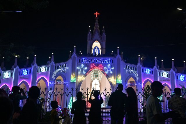 Christians gather at Mount Mary Church on Christmas eve in Mumbai on December 24, 2024. (Photo by Punit Paranjpe/AFP Photo)