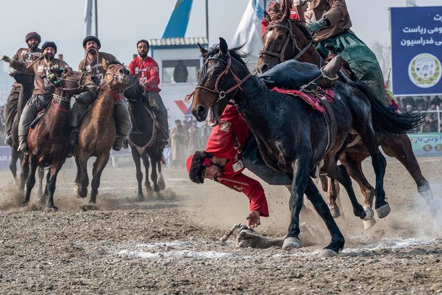 Afghan horsemen from the Badakhshan and Faryab teams compete during the sixth annual Buzkashi League of Afghanistan in Kabul on December 16, 2024. (Photo by Wakil Kohsar/AFP Photo)