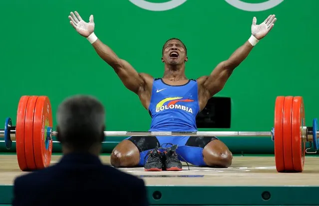 Oscar Albeiro Figueroa Mosquera, of Colombia, celebrates after winning the gold medal in the men's 62kg weightlifting competition at the 2016 Summer Olympics in Rio de Janeiro, Brazil, Monday, August 8, 2016. Mosquera retired after his last lift. (Photo by Mike Groll/AP Photo)