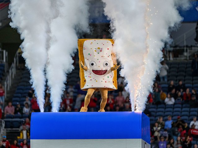 The Pop-Tarts Bowl mascot entertains the crowd during the first half of the college football game in Orlando, Florida, on Thursday, December 28, 2023. He was later “toasted” in the postgame festivities while holding a sign that said “Dreams really do come true”. (Photo by Romeo Guzman/AP Photo)