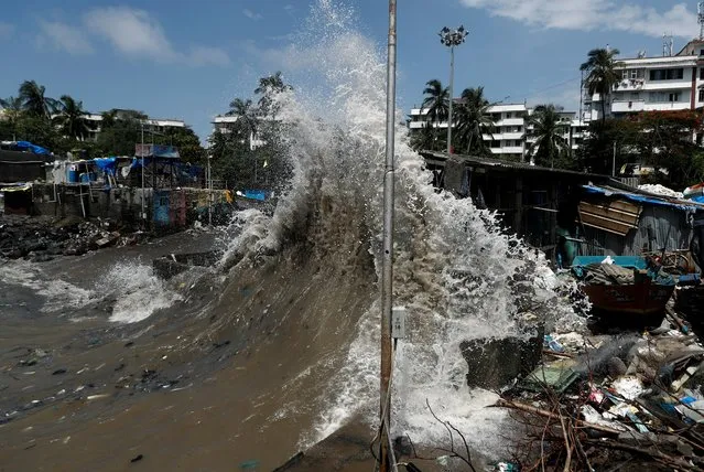 A wave breaks along a seafront during high tide in Mumbai, India on July 24, 2020. (Photo by Francis Mascarenhas/Reuters)