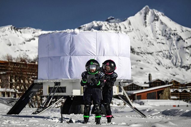 Researchers take part in a lunar simulation exercise to test the EuroHab space dwelling, in Tignes resort on January 23, 2024. Peter Weiss and Jean-Jacques Favier, two of the co-founders of Spartan Space, have developed the EuroHab concept, an inflatable habitat for missions on the surface of the Moon or Mars, developed as part of the CNES “Tech The Moon” program and supported by the European Space Agency (ESA). (Photo by Jeff Pachoud/AFP Photo)