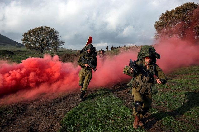 Israeli soldiers take part in a drill at the Israeli-occupied Golan Heights, amid the ongoing conflict between Israel and the Palestinian Islamist group Hamas on January 4, 2024. (Photo by Ronen Zvulun/Reuters)