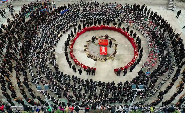 This aerial photo taken on November 24, 2022 shows people of the Dong ethnic minority celebrating the Dongnian festival in Rongjiang county, Qiandongnan Miao and Dong Autonomous Prefecture, in China's southwestern Guizhou province. (Photo by Reuters/China Stringer Network)