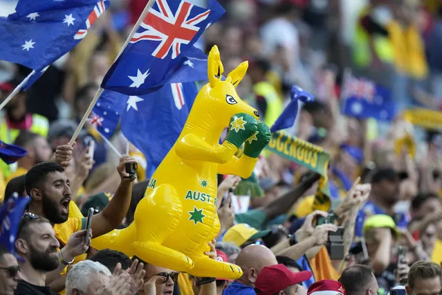 Australia's fans celebrate after winning the World Cup group D soccer match between Tunisia and Australia at the Al Janoub Stadium in Al Wakrah, Qatar, Saturday, November 26, 2022. (Photo by Luca Bruno/AP Photo)