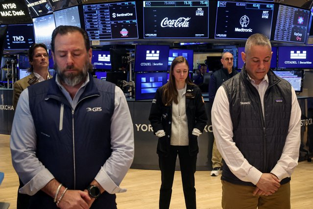 Traders hold a moment of silence on the floor at the New York Stock Exchange, after the death of Pope Francis was announced by the Vatican, on April 21, 2025. (Photo by Brendan McDermid/Reuters)