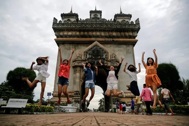 Women jump as they pose for photo in front Patuxay park, ahead of the ASEAN Summit in Vientiane, Laos September 5, 2016. (Photo by Soe Zeya Tun/Reuters)