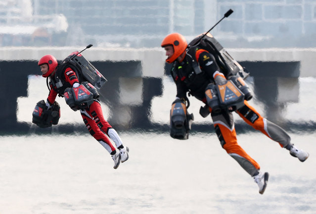 Competitors in action during the world’s first jet suit race at Dubai Harbour on February 28, 2024, which was organised by the Dubai Sports Council and Gravity Industries, a jet suit company. (Photo by Satish Kumar/Reuters)