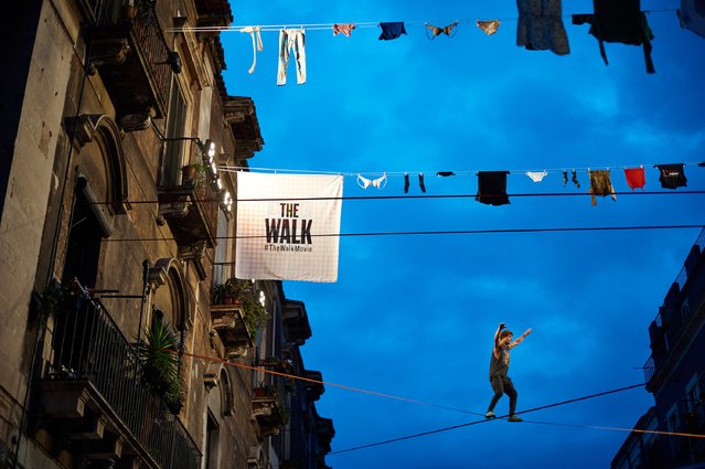 Tauri Vahesaar of Estonia at the Red Bull Airlines and "The Walk" movie freestyle slackline competition above the balconies in Catania, Sicily. (Photo by Guido De Bortoli/Getty Images for Sony Pictures Entertainment)