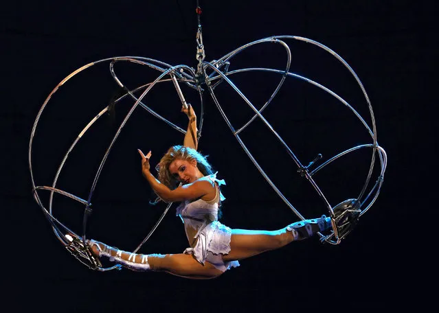 An acrobat performs during the presentation of the new show “The victors of arena” at the Belarus State Circus in Minsk, Belarus, September 23, 2016. (Photo by Vasily Fedosenko/Reuters)